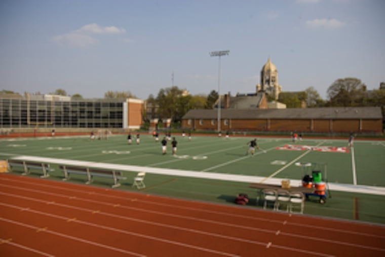 The men's lacrosse team practices on the field at Muhlenberg College before its last game there. "We've been assured the new one will have no lead in it," said David Rabold, the capital-projects manager. "And we will get that in writing."