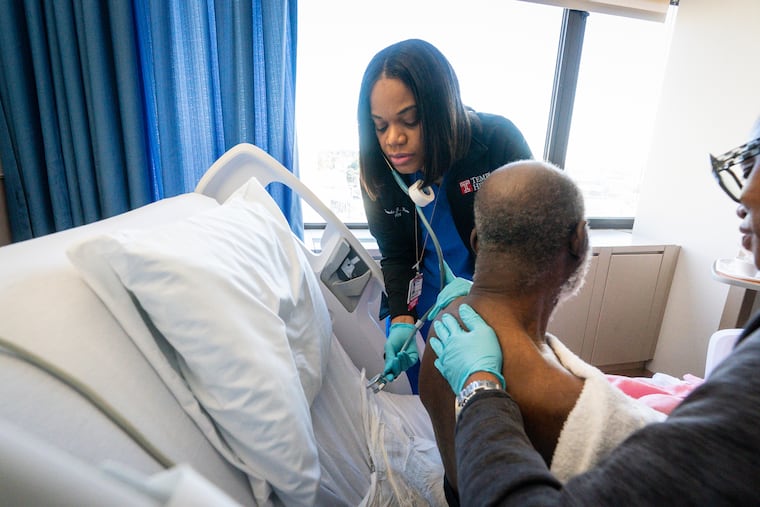 Temple University Hospital received a B rating in the latest Leapfrog safety report. Here, a nurse is shown working with a patient in September 2023.