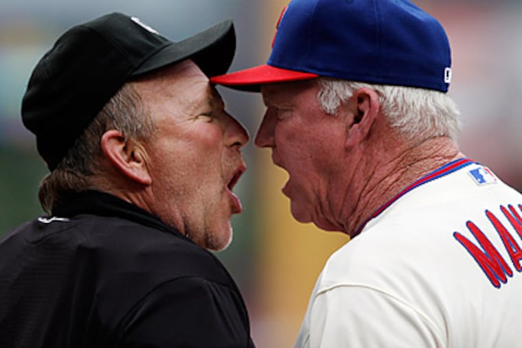 Charlie Manuel and home plate umpire Bob Davidson argue after Manuel was ejected. (David Maialetti/Staff Photographer)
