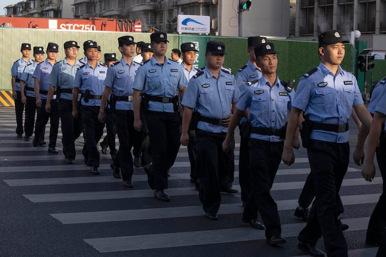 Chinese policemen prepare for duty around a neighborhood sealed off before the official closure of the United States Consulate in Chengdu in southwest China's Sichuan province, Monday, July 27. China ordered the United States on Friday to close its consulate in the western city of Chengdu, ratcheting up a diplomatic conflict at a time when relations have sunk to their lowest level in decades.