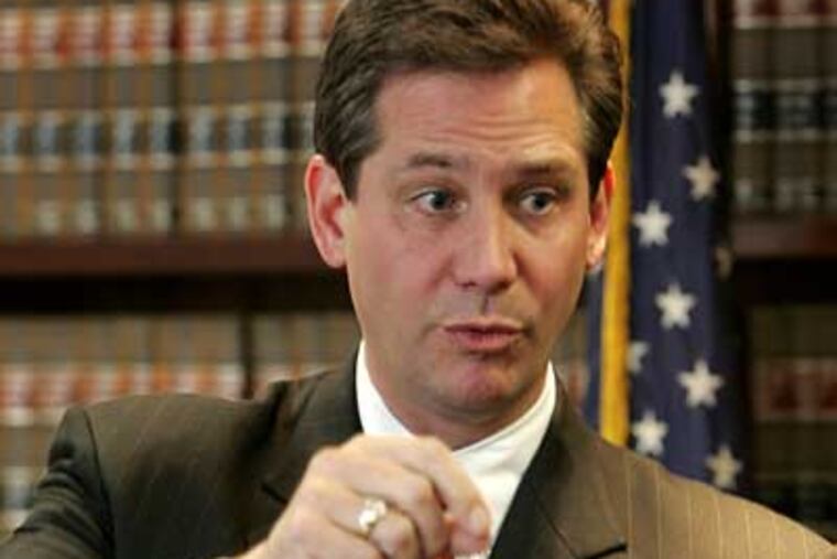 Montgomery County District Attorney Bruce Castor speaks at a Dec. 28 news conference. Authorities investigating the bludgeoning death of an Ivy League professor's wife believe the slaying was staged to look like a burglary, the district attorney said. (AP Photo/Rusty Kennedy)
