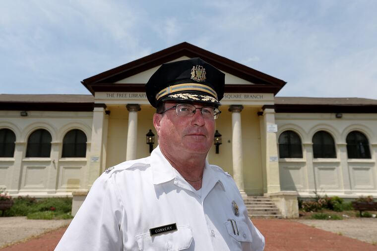 Inspector Ray Convery, head of East Division, has worked to clean-up McPherson Square in Kensington. He is pictured in front of the library in the square on July 20, 2017.