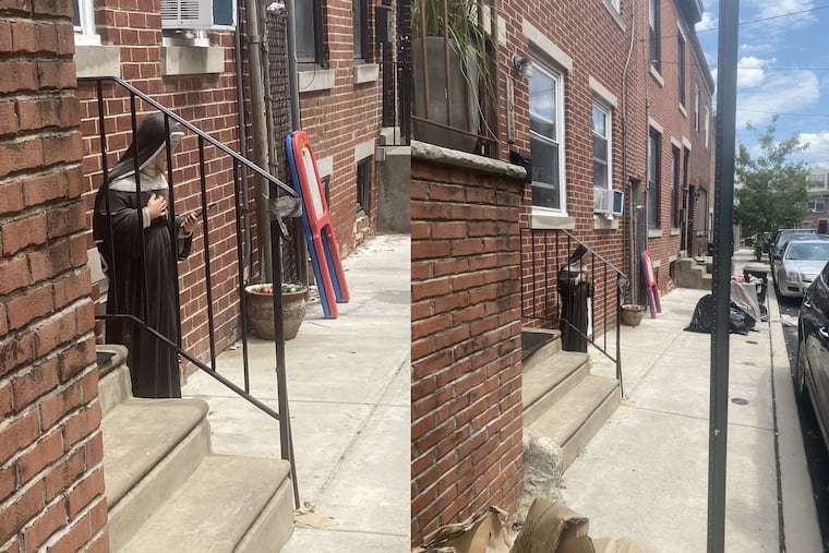 Statue of St. Rita of Cascia located on Webster Street earlier Saturday afternoon. It was returned by police to its shrine.
