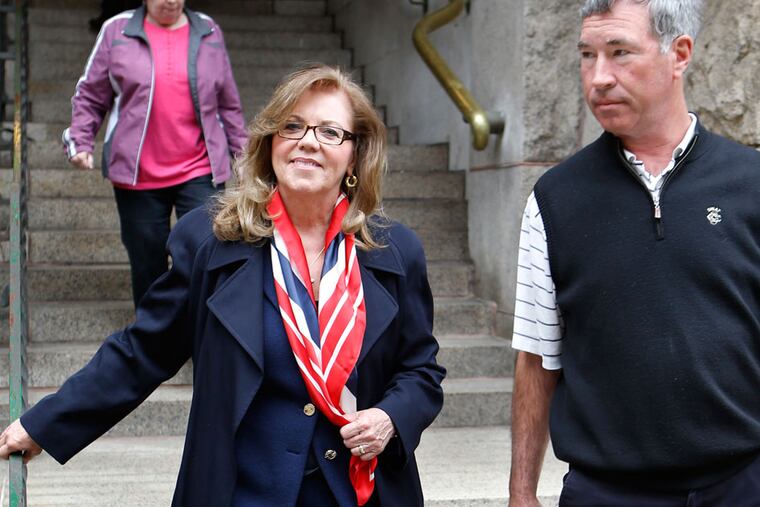 Former state Supreme Court Justice Joan Orie Melvin, left, leaves court with her husband Greg Melvin after she and her sister, Janine Orie, were sentenced for their February convictions on corruption in Orie Melvin's election campaign, on Tuesday, May 7, 2013, in Pittsburgh. The sisters avoided prison time but were sentenced to house arrest for what a judge called crimes of "arrogance." (AP Photo/Keith Srakocic)