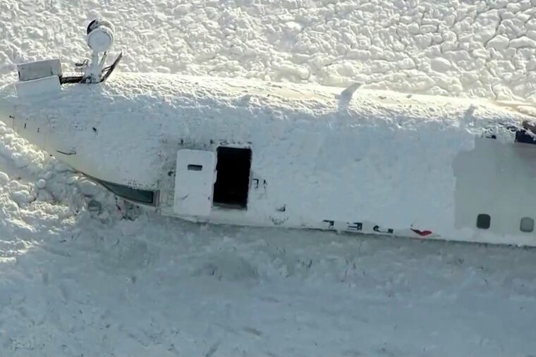 This image taken from video provided by CTV shows an aerial view of the overturned plane at Toronto Pearson Airport on Tuesday, Feb. 18, 2025.