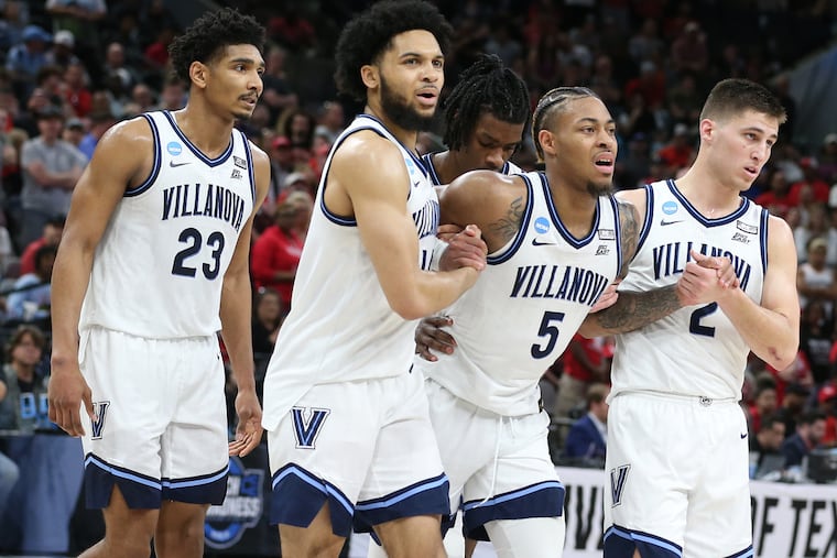 Villanova's Justin Moore helped off the court late in last season's NCAA Elite Eight game after suffering a torn Achilles.
