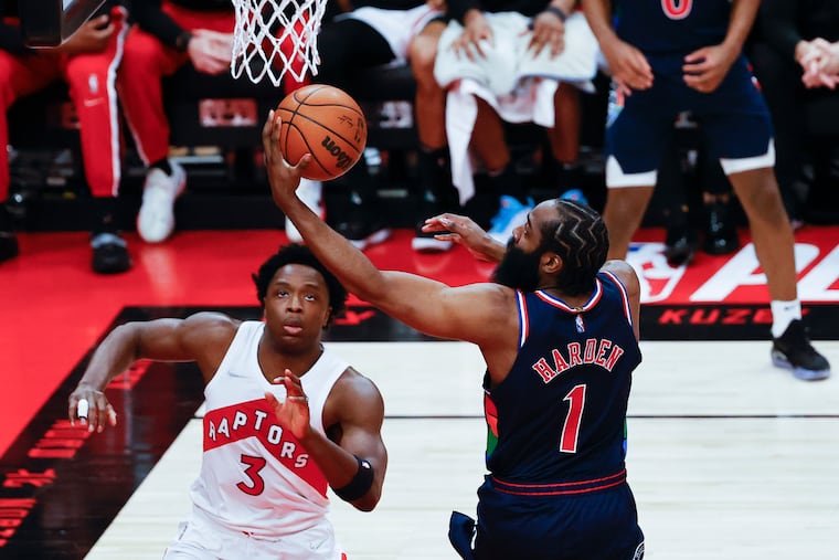 Sixers guard James Harden lays-up the basketball against Toronto Raptors forward OG Anunoby during game six of the first-round Eastern Conference playoffs on Thursday, April 28, 2022 in Toronto.