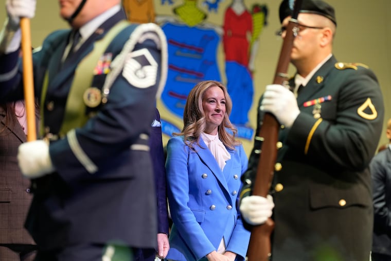 New Jersey Gov. Mikie Sherrill stands as an honor guard passes by during her inauguration ceremony in Newark, N.J., Tuesday, Jan. 20, 2026.