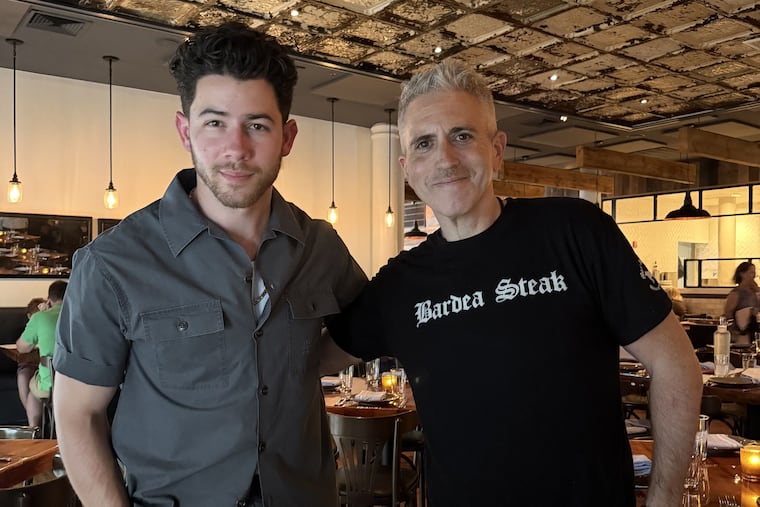 Nick Jonas (left) at Bardea Food & Drink in Wilmington with co-owner Scott Stein on June 6, 2026.