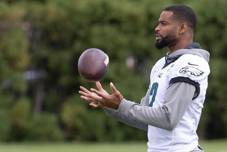 Philadelphia Eagles' Darius Slay, plays with a football at the NFL football team's practice facility in Philadelphia, Wednesday, September 28, 2022.