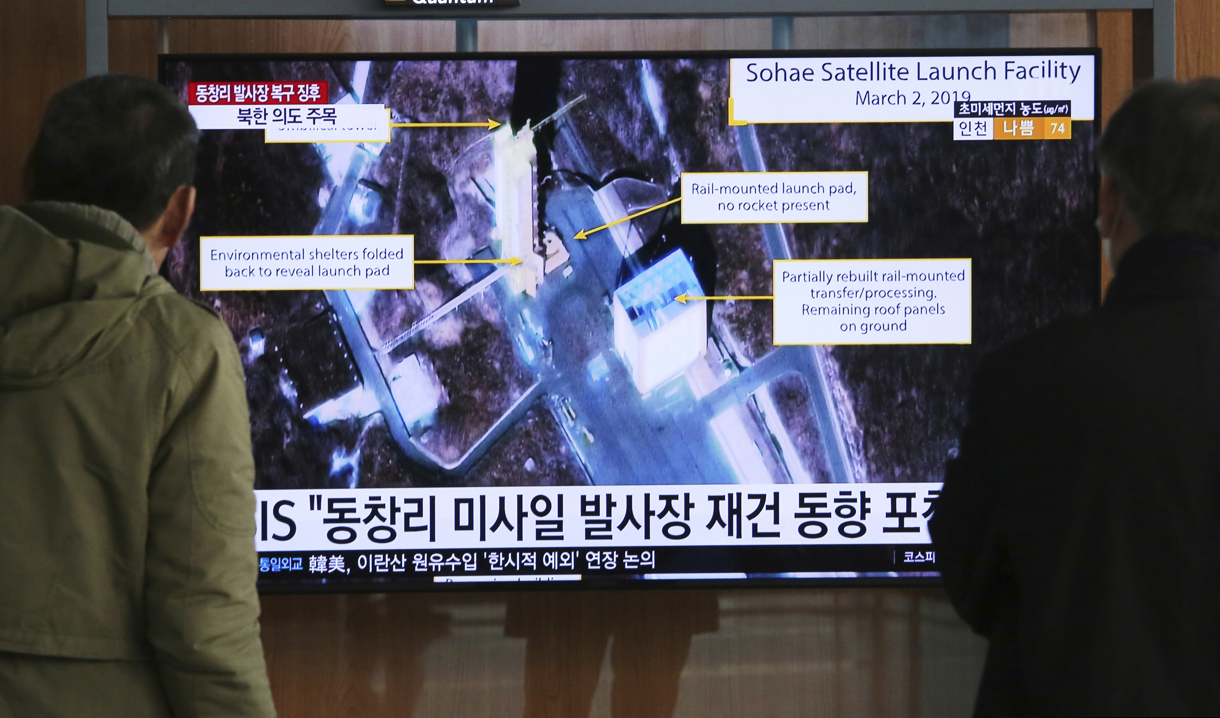 In this March 6, 2019, file photo, people watch a TV screen showing an image of the Sohae Satellite Launching Station in Tongchang-ri, North Korea, during a news program at the Seoul Railway Station in Seoul, South Korea.