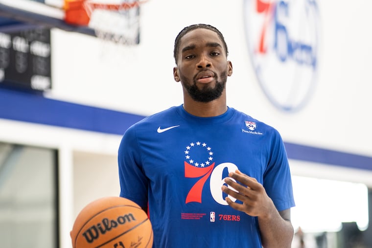 Sixers guard Shake Milton wears a shooting shirt with Penn Medicine branding.