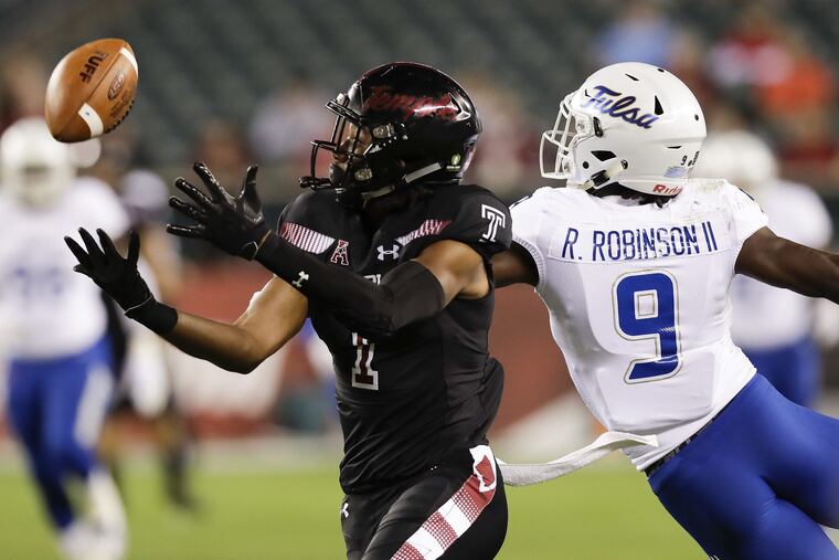 Temple wide receiver Ventell Bryant watches the football against Tulsa cornerback Reggie Robinson II on Thursday, September 20, 2018 in Philadelphia. YONG KIM / Staff Photographer