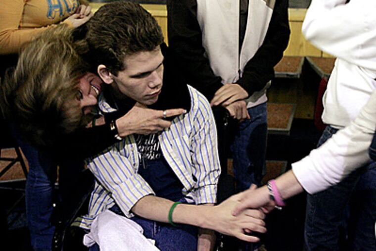 Students greet Maureen Morella and her son Jesse at a Wayne, N.J. high school in 2006. Jesse, 18, a quadriplegic, nearly died from a heroin overdose. Experts say the number of heroin-addicted high school students is on the rise. (James W. Anness/MCT/File)