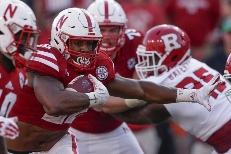 Nebraska’s Devine Ozigbo carries the ball against Rutgers during a September game.