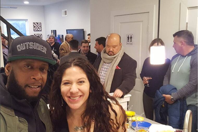 Karin Wolok shares a photo with Talib Kweli at #SomersSocial open house.