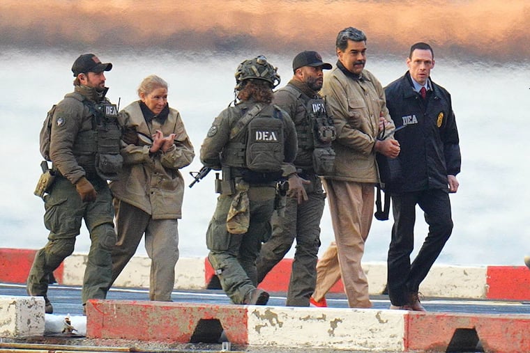 Nicolás Maduro and his wife, Cilia Flores, are escorted by federal agents after landing at a helipad in Manhattan on Monday.