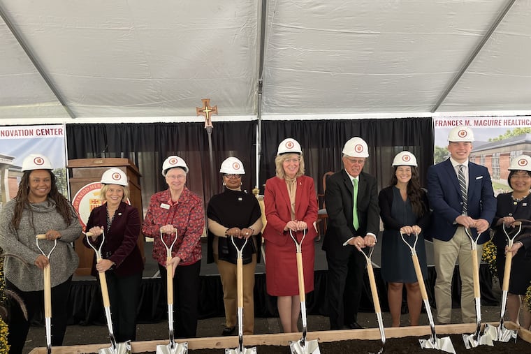 Gwynedd Mercy University officials and other dignitaries break ground on the Frances M. Maguire Healthcare Innovation Center, including James Maguire (fourth from the left) and university president Deanna D'Emilio (fifth from the left).