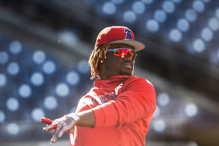 The Phillies' Odubel Herrera warms up during a workout at Citizens Bank Park on Tuesday.