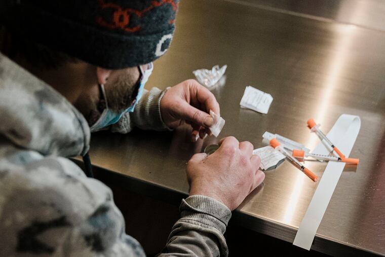 A man uses the narcotic consumption booths at a safe injection site at OnPoint NYC in New York.