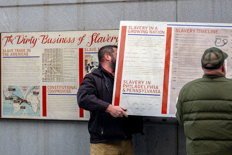 Workers remove the display panels about slavery at the President’s House site in Independence National Historical Park, Thursday, Jan. 22, 2026. The fate of exhibits at the site, which serves as a memorial to the nine people George Washington enslaved there during the founding of America, had been in limbo since President Donald Trump’s executive order, “Restoring Truth and Sanity to American History,” directed the U.S. Department of the Interior to review over 400 national sites to remove or modify interpretive materials that “inappropriately disparage Americans past or living.”