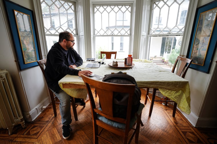 Paul Green, founder of the Paul Green School of Rock Music, is shown in his work space in his home in Philadelphia on April 16, 2021.