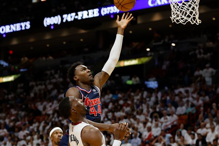 Sixers forward Paul Reed shoots the basketball over Miami Heat center Bam Adebayo during Game 1.