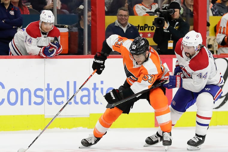 Nate Thompson, then with Montreal, hounds Flyers defenseman Shayne Gostisbehere in an early-season game. Thompson was dealt to the Flyers at the trade deadline and will try to help them defeat his ex-teammates in the playoffs.