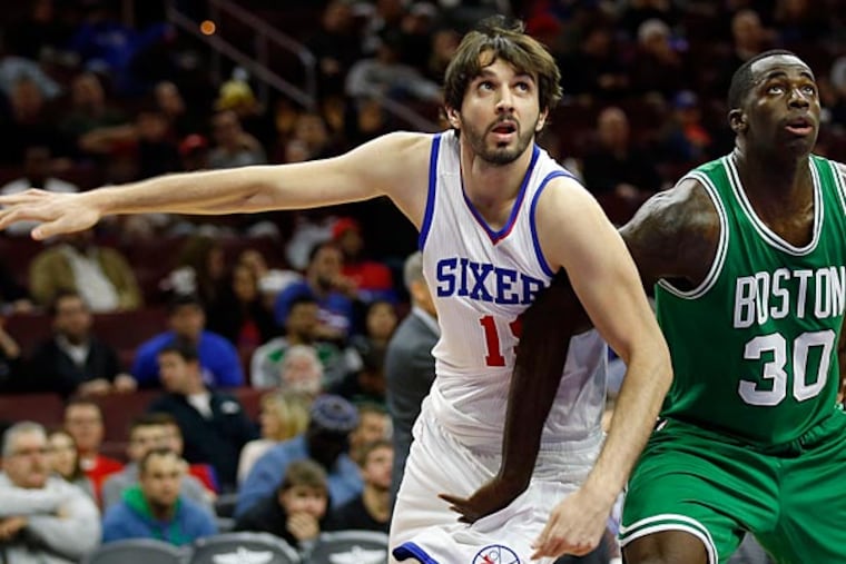 Furkan Aldemir tries to box out the Celtics' Brandon Bass. (Yong Kim/Staff Photographer)