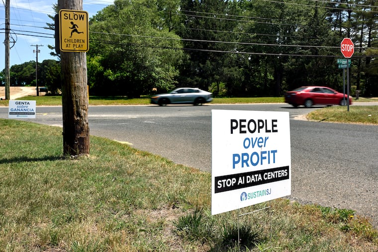 Yard sign in front of home on Lincoln Avenue June 9, 2026 near the under-construction Nebius AI data center in Vineland, N.J. The sign is from SUSTAIN SJ, a non-profit of “South Jersey residents advocating for clean air, responsible development, and local government that works for the people they represent.” The project is being built by Data One, which owns the facility. Nebius Group — a Netherlands-based company that recently announced its $17 billion deal with Microsoft to supply computer power from its Vineland center — will operate the artificial intelligence infrastructure inside.
