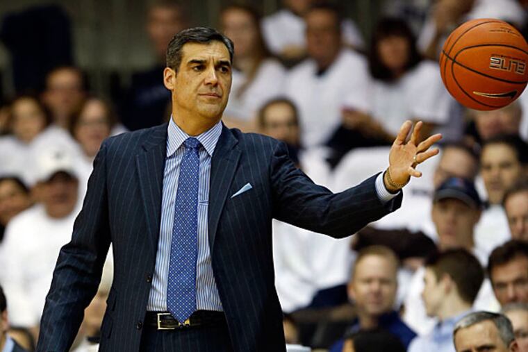 Villanova Head Coach Jay Wright tosses the basketball to game officials. (Yong Kim/Staff Photographer)