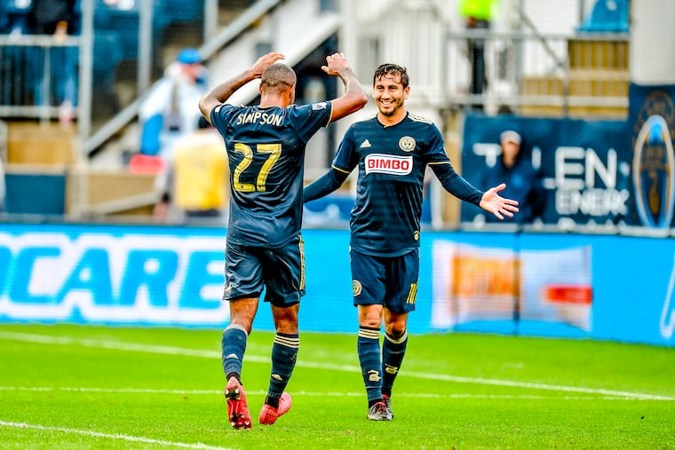 Alejandro Bedoya (right) celebrates with Jay Simpson after one of Simpson's goals for the Philadelphia Union against Sporting Kansas City.