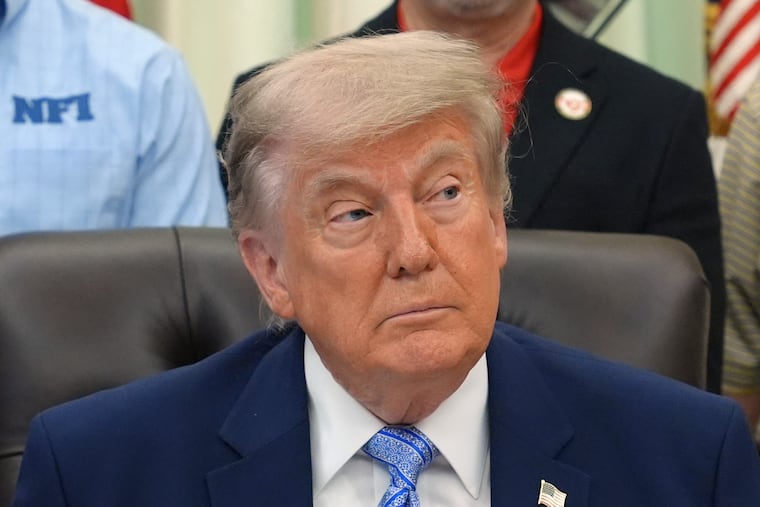President Donald Trump meets with reporters in the Oval Office on Thursday.
