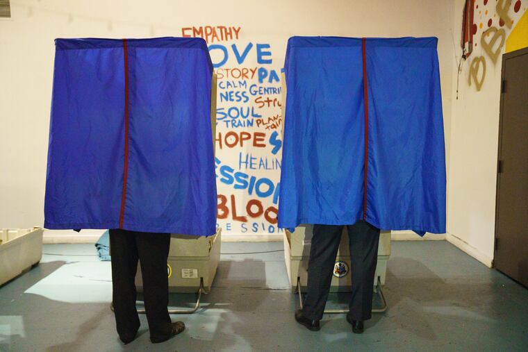 Mayor Jim Kenney, right, votes at the Painted Bride in Philadelphia on May 21.