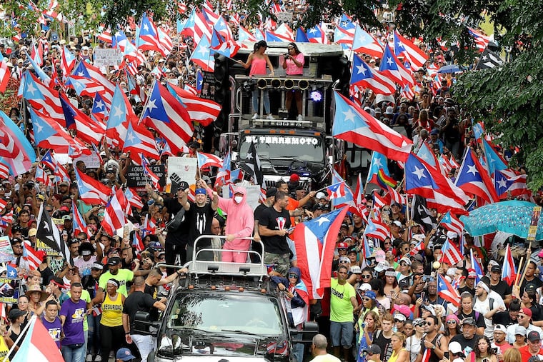 Artists Residente and Bad Bunny joined a march along F.D. Roosevelt Avenue a day after Puerto Rico's governor Ricardo "Ricky" Antonio Rossello Nevares announced he will step down effective Aug. 2.