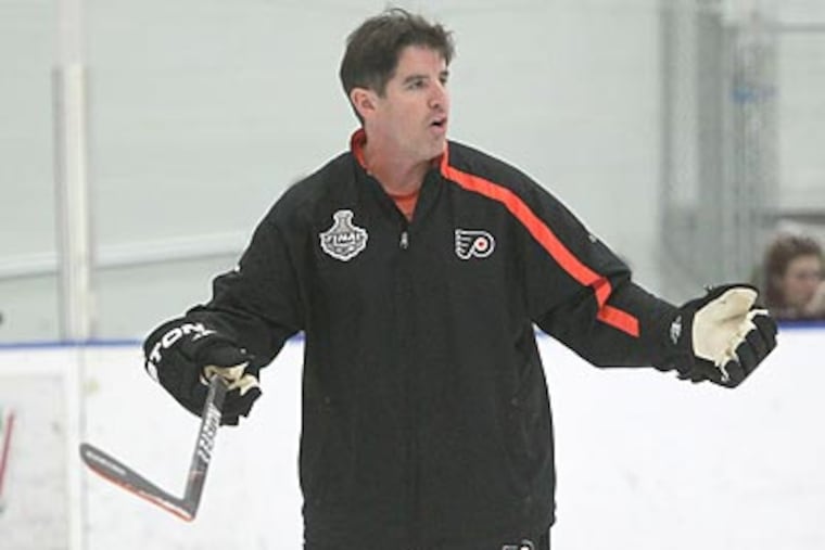 Peter Laviolette did not have one of his trademark outbursts during Game 1 against Boston. (Charles Fox/Staff Photographer)