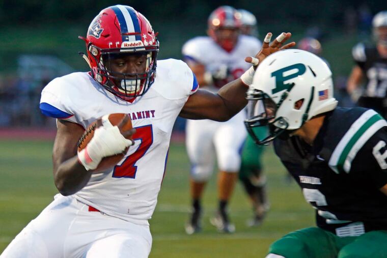 Neshaminy running back Will Dogba slices past Pennridge defender Joe Devine in the first half of a nonleague football game Friday night, Sept. 2, 2016, at Pennridge.