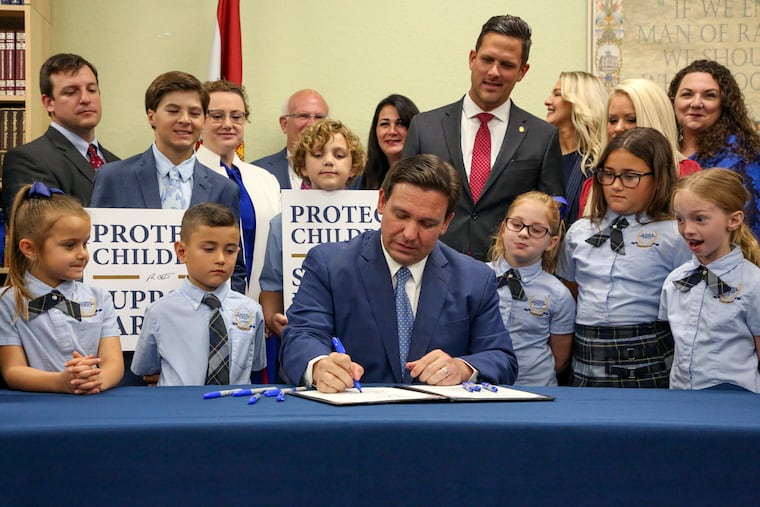 Florida Gov. Ron DeSantis signs the Parental Rights in Education bill at Classical Preparatory School, on March 28, 2022, in Shady Hills, Fla.