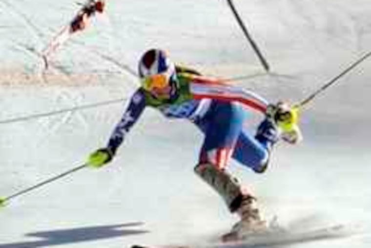 The last competitor on the course, Lindsey Vonn loses her balance and tumbles after striking a gate in the super-combined.