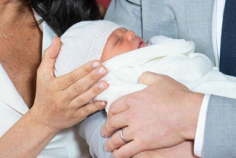 Britain's Prince Harry and Meghan, Duchess of Sussex, during a photocall with their newborn son, in St George's Hall at Windsor Castle, Windsor, south England, Wednesday May 8, 2019. Baby Sussex was born Monday at 5:26 a.m. (0426 GMT; 12:26 a.m. EDT) at an as-yet-undisclosed location. An overjoyed Harry said he and Meghan are "thinking" about names.
