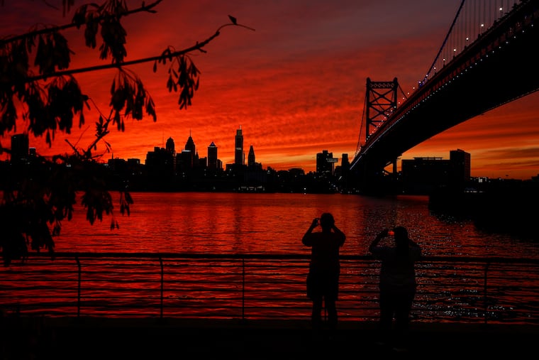The sun sets behind the Philadelphia skyline, seen from the Camden Waterfront on Tuesday, Sept. 30, 2025 in Camden, NJ.