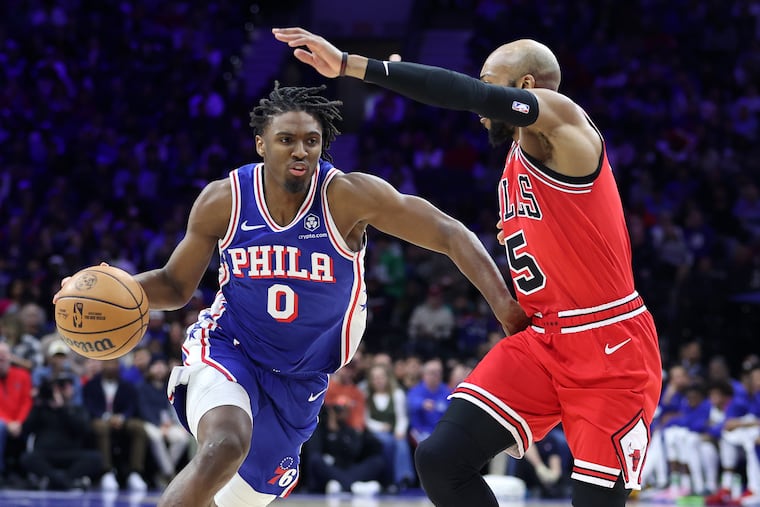 Tyrese Maxey (left) of the Sixers drives against Jevon Carter of the Bulls during the first half of their game at the Wells Fargo Center on Jan. 2, 2024.