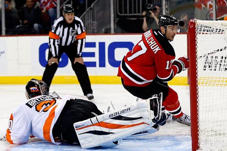New Jersey Devils left wing Ilya Kovalchuk (17) scores on
a penalty shot against Philadelphia Flyers goalie Ilya Bryzgalov during the second period of an NHL hockey game, Tuesday, Jan.
22, 2013, in Newark, N.J. (AP Photo/Julio Cortez)