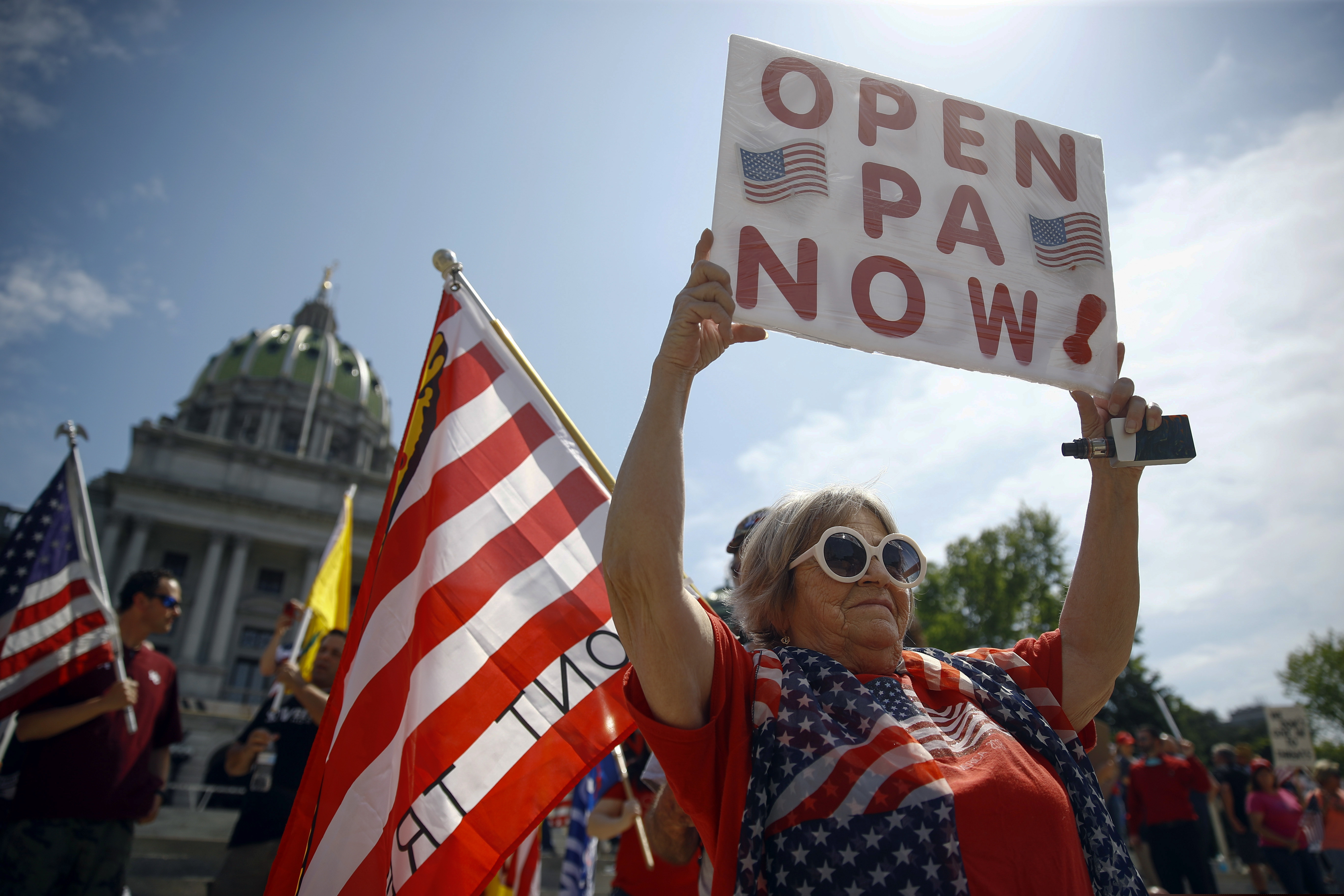 Protesters demonstrate during a rally against Pennsylvania's coronavirus stay-at-home order at the state Capitol in Harrisburg, Pa., on May 15, 2020.