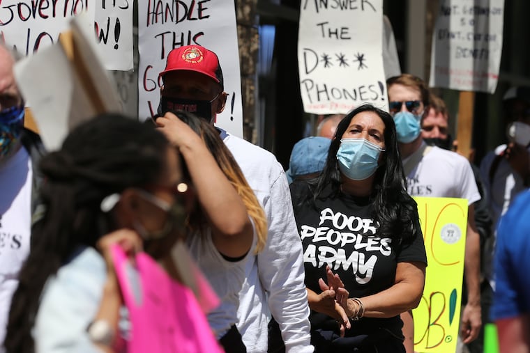 Longtime activist Cheri Honkala (right) joins a group of unemployed workers as they protest in Philadelphia, Pa. on May 6, 2021. Millions of jobless workers lost unemployment benefits this week when federal programs expired.