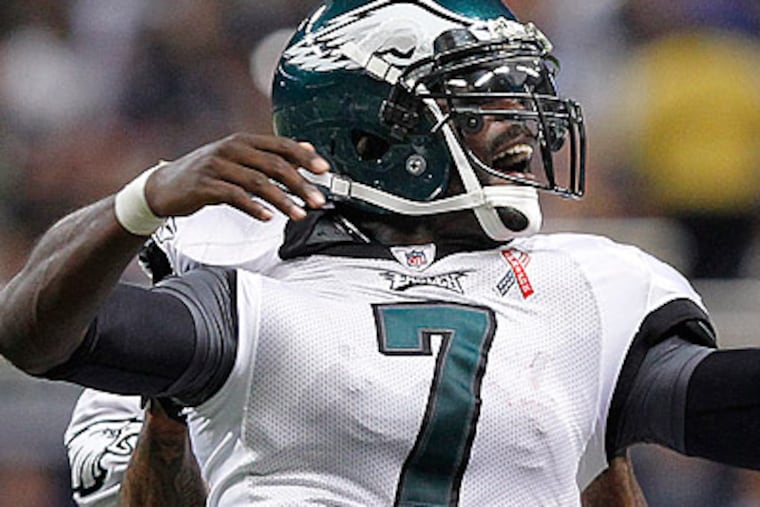 Quarterback Michael Vick threw two touchdowns in the Eagles' win over the Rams on Sunday. (Ron Cortes/Staff Photographer)