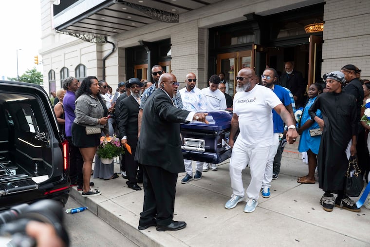 Pallbearers including O’Shae Sibley’s father Jake Kelly (right) carry Sibley’s casket towards the hearse outside of The Met.