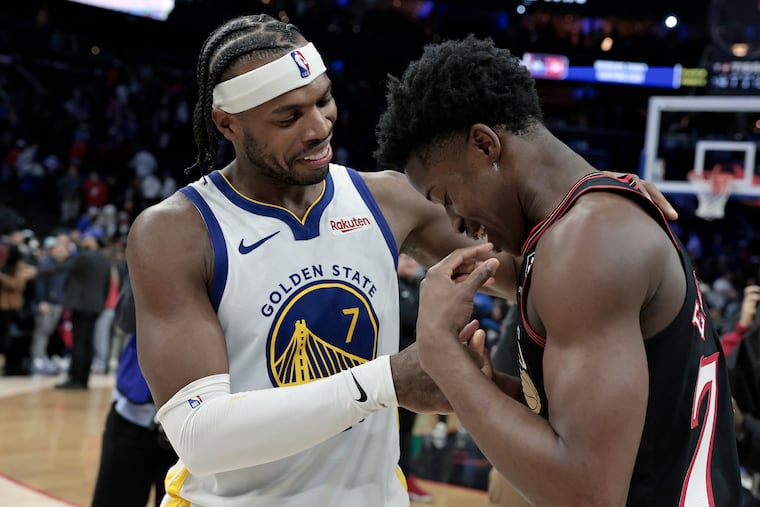 Golden State’s Buddy Hield (left) and Sixers VJ Edgecombe after the Golden State Warriors at Philadelphia 76ers NBA game at Xfinity Mobile Arena in Philadelphia on Thursday, Dec. 4, 2025.