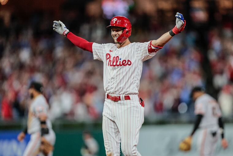 Trea Turner celebrates his walk-off two-run single to beat the Giants, 4-3 on Tuesday.
