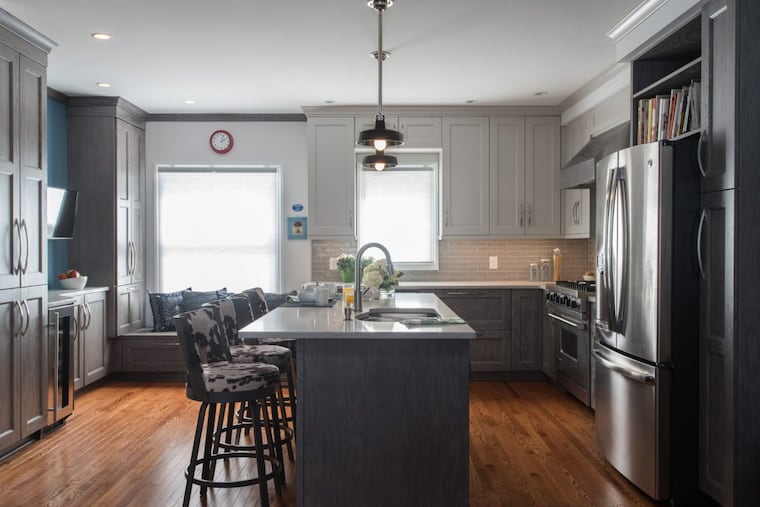 Tim and Robin Lung’s kitchen in Queen Village has a clean, uncluttered look, thanks to storage such as a bench to hold cleaning supplies, a floor-to-ceiling pull-out pantry, and built-in wine storage.